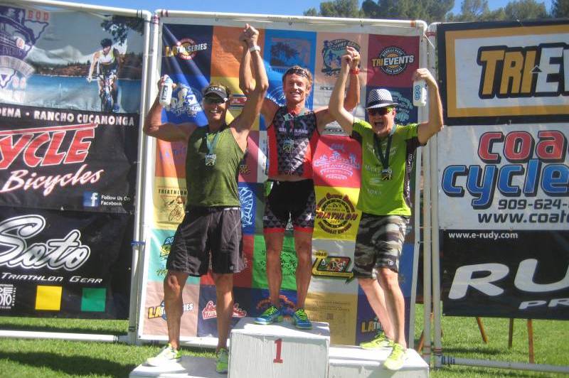 Podium finishers smiling with medals