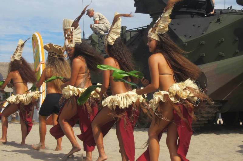 Women in traditional costumes dancing outdoors