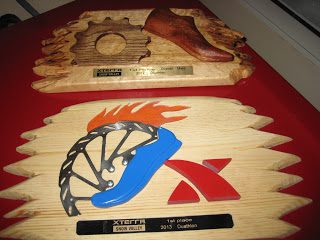 XTERRA competition trophies on red background