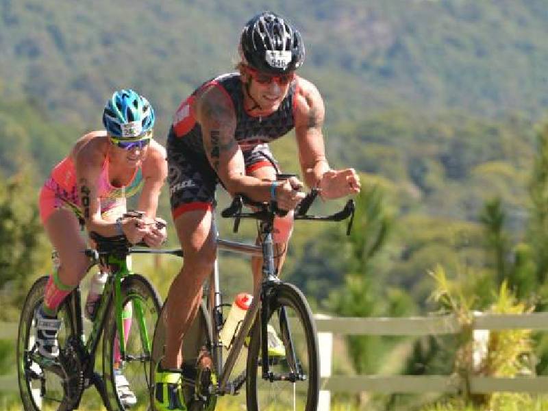 Two athletes competing in cycling race