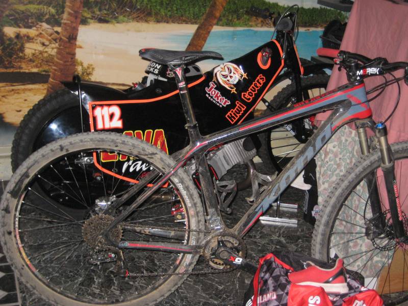 Bicycles displayed with gear in background