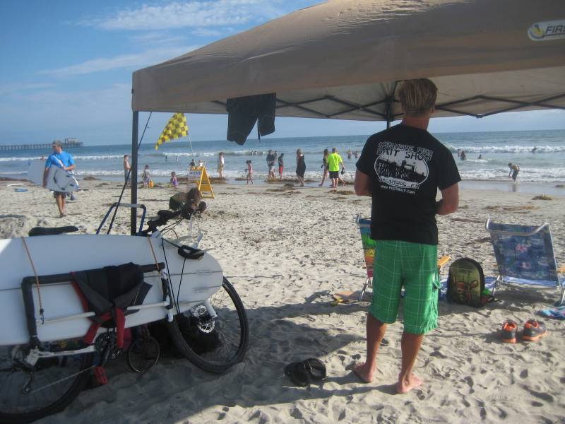 Bicycle parked on sandy beach